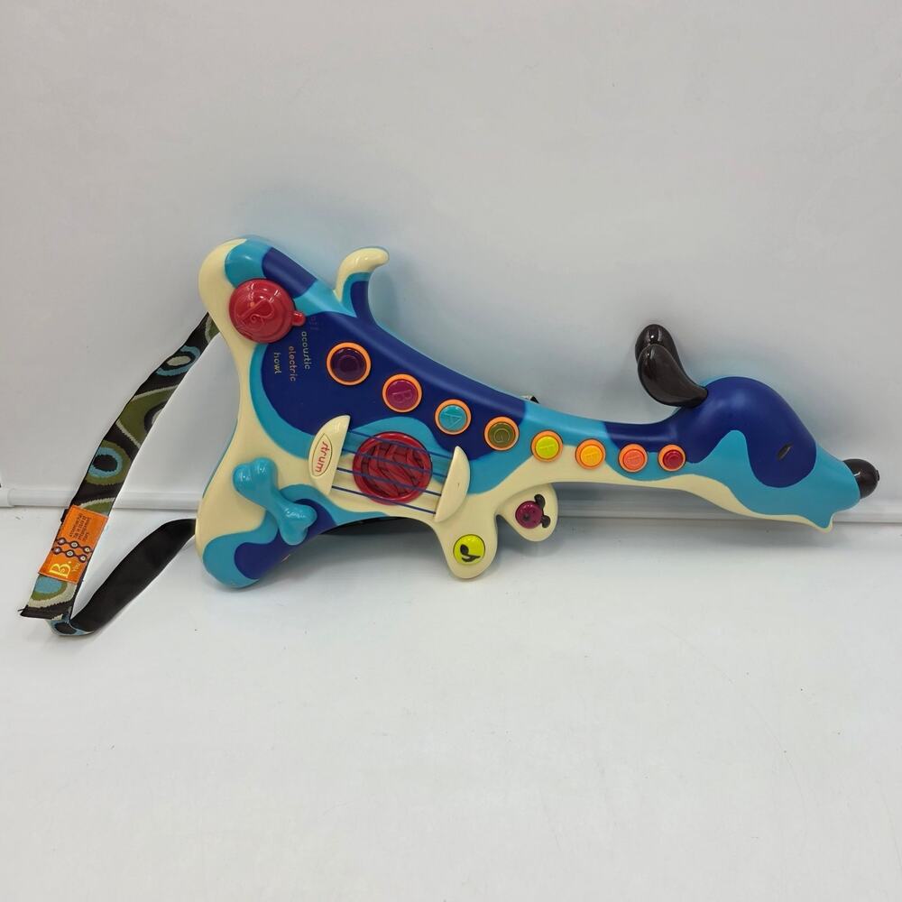 B. Woofer Interactive Hound Dog Guitar Strum Musical Learning Toy B. Toys TESTED